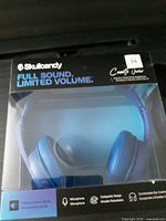 Front of retail box showing blue Skullcandy Cassette Junior headphones