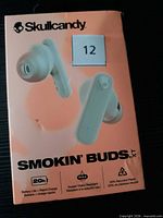 Front view of retail box showing brand, model and imagery of earbuds