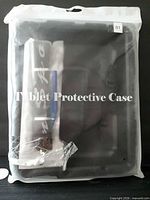 Front of sealed retail pouch containing black tablet case