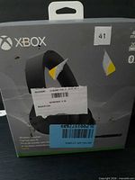 Front of Xbox wireless headset box with torn shipping labels