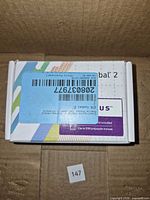 Top view of unopened ZTE Cymbal 2 phone box with Telus branding and barcode sticker