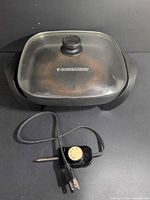 Skillet with lid and probe visible