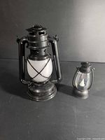 Front view of both lanterns showing size difference and black finish