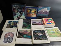 Group shot of all eleven catalogs and calendar