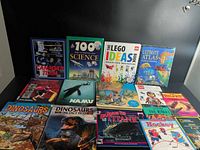 All 15 books laid out front covers visible