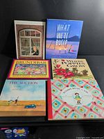 All six hardcover books laid out, front covers visible