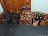 Group shot of all nine wicker pieces lined up against wall
