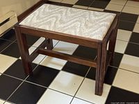 Overall view of walnut footstool showing upholstered seat and block legs