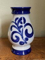 Front view showing blue swirl motif and shape