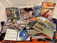 Overall view of DVDs and magazines spread on cloth