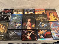 All 13 DVD cases laid out in three rows