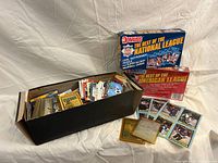 Overall lot with two Donruss boxed sets, open storage box of loose cards, visible Score hockey cards