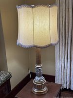 Full view of lamp with shade on table