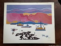 Full view of framed Ted Harrison print with Arctic industrial scene