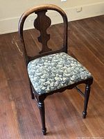 Front view showing overall chair design and upholstery