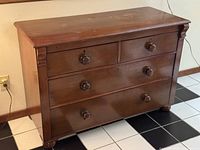 Front view showing drawer layout and hardware