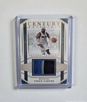 Front of Vince Carter Century Materials patch card with visible three-color jersey swatch
