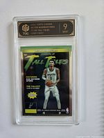 Front of encased 2023 Topps Chrome Tall Tales Victor Wembanyama card showing player image and grade label 9 Mint