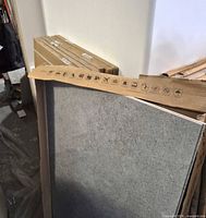 Grey concrete-look tile leaning against boxed packs