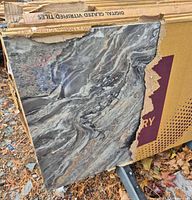 Front of loose tile showing grey marble pattern