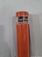 Full view of roll showing orange vinyl and label