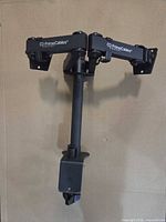 Front view showing both adjustable arms, pole and desk clamp