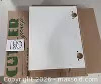 White cabinet door showing front face and pre-drilled hinge holes