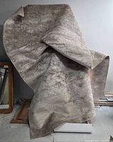 Rug displayed draped to show overall colour and texture