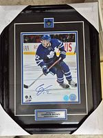 Front view of framed, signed Connor Brown photo showing autograph, matting, plaque, crest