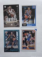 Front view of four Immanuel Quickley rookie cards