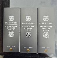 Front view of three boxed McDonald's NHL Star Sticks 2025-2026
