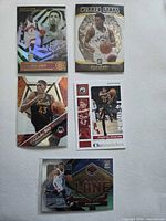Group shot of all five Toronto Raptors trading cards laid out
