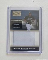 Front view of Donruss Prime Patches Vernon Wells card showing player image, jersey swatch, serial number, and protective case