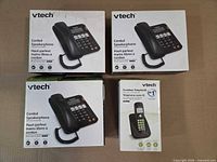 Four retail boxes: three VTech Corded Speakerphone, one VTech Cordless Telephone