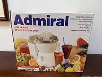 Retail box displaying Admiral 600 Series Juice Extractor with product image and feature list