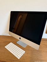 Front view of iMac and keyboard on desk