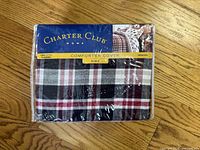 Front view of sealed Charter Club Gregory plaid king comforter cover packaging