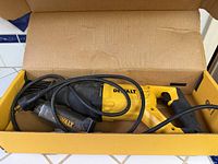 DeWalt corded reciprocating saw inside box with blade tube