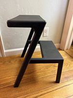 Side profile showing A-frame design and two steps