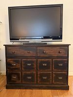 Front view showing entire cabinet with drawer layout and finish