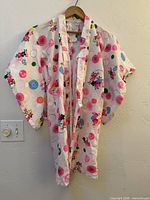 Full view of children’s kimono hanging on hanger