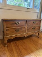 Front three-quarter view of Lane cedar blanket chest showing faux drawers, hardware, apron and legs