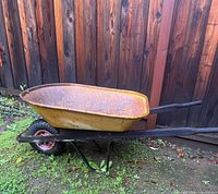 side view of entire metal wheelbarrow