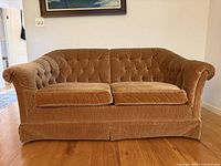 Front view showing full loveseat, two seat cushions, skirted base