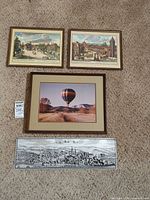 All four framed pieces laid out on carpet