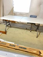 Folding table with chair underneath