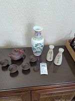 Full view of all ceramic items on cabinet