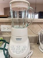 Full view of blender assembled on countertop showing jar, base, power cord