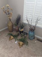 Group view of all vases, pots, sconces and arrangements