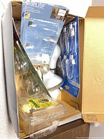 Box containing packaged and loose bulbs